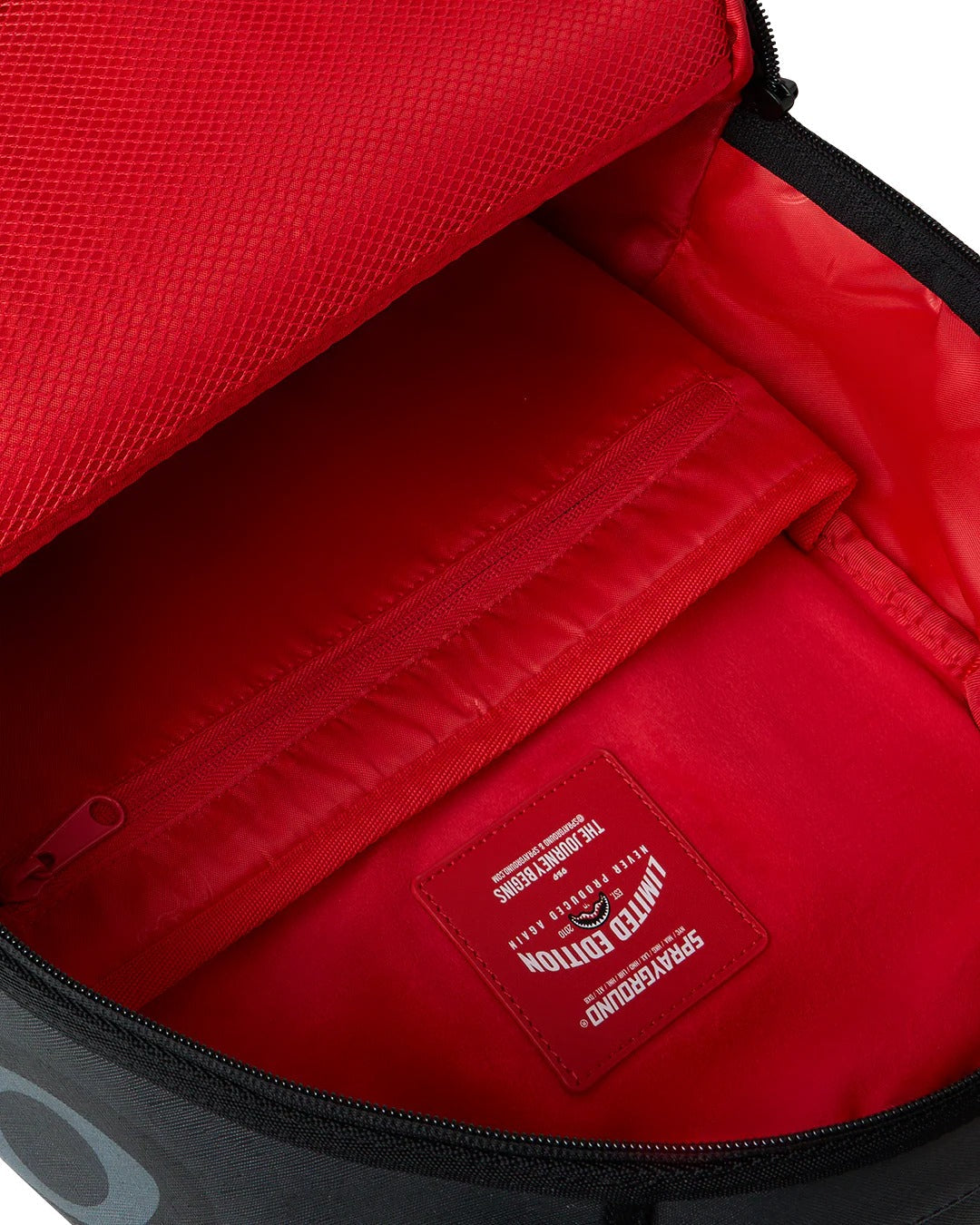 Sprayground Zaino Center rip revealing gray check Nero